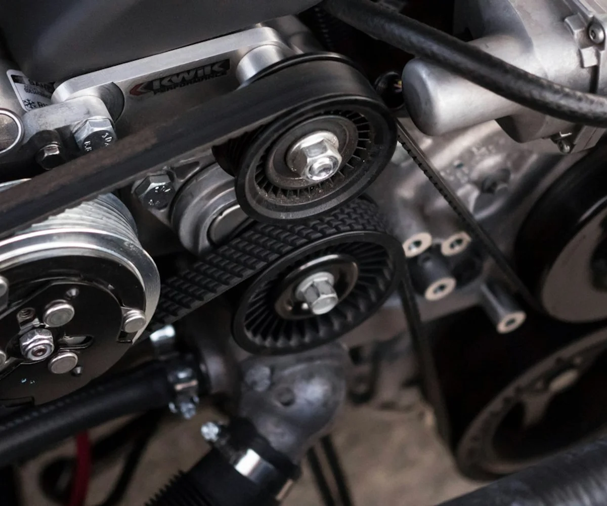 Close-up of a car engine during maintenance.